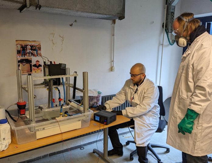 Engineers testing a hardware prototype in the lab